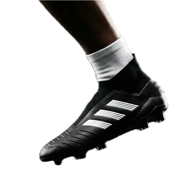 Soccer cleat stepping forward from right